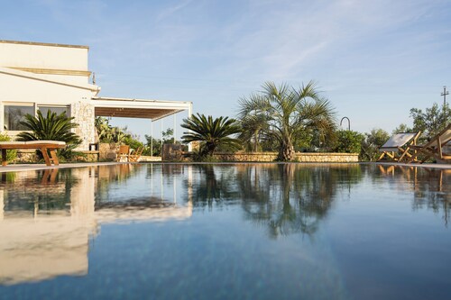 Cici and Michela estate surrounded by greenery with private pool