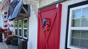 A building with a red door, a sign reading "Hotel", and a wreath on the door. - Enjoy the beautiful views of the Muskegon River near Hardy Dam and Dragon Trail (Newaygo)