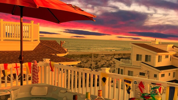 A balcony with a hot tub, a red umbrella, and a view of the beach and ocean at sunset.