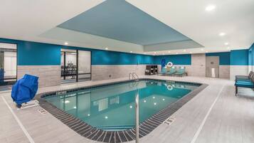 Indoor pool, open 7:00 AM to 10:00 PM, pool loungers
