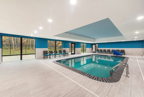 Indoor pool, open 7:00 AM to 10:00 PM, pool loungers