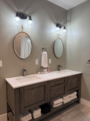 Combined shower/tub, hair dryer, towels, soap