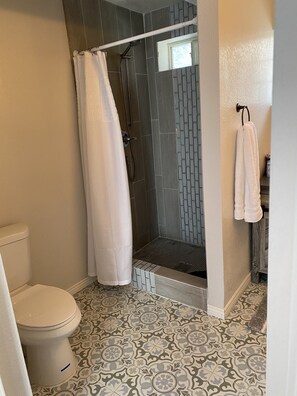 Bathtub, hair dryer, towels, soap