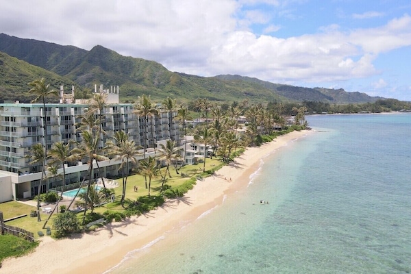 The vacation condo is a beach front property in a beautiful Hawaiian Paradise.