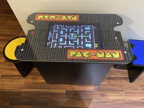 A Pac-Man arcade game on a table. - Coosawattee-2 King Beds, Hot Tub, Pool Table, Fire Pit, Arcade, Resort Amenities (Ellijay)