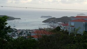 A coastal town with buildings and a view of the sea.