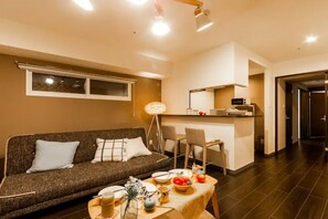 Apartament, no fumadors | Sala d'estar | Televisor de pantalla plana