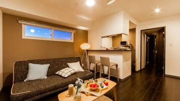 Apartment, Non Smoking | Living area | Flat-screen TV