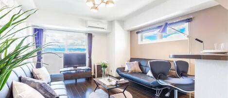 Apartment, Non Smoking | Living area | Flat-screen TV
