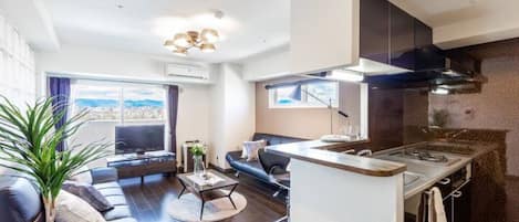 Apartment, Non Smoking | Living area | Flat-screen TV