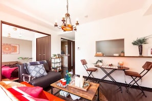 Apartment, Non Smoking | Living area | Flat-screen TV