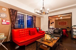 Apartment, Non Smoking | Living area | Flat-screen TV