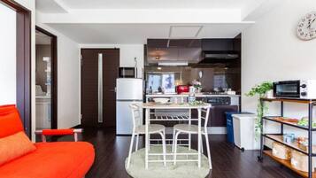 Apartment, Non Smoking | Living area | Flat-screen TV