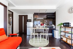 Apartment, Non Smoking | Living area | Flat-screen TV