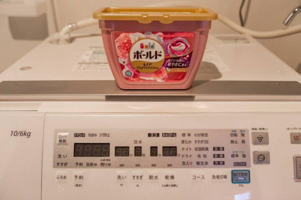 A weighing scale with a container on it.