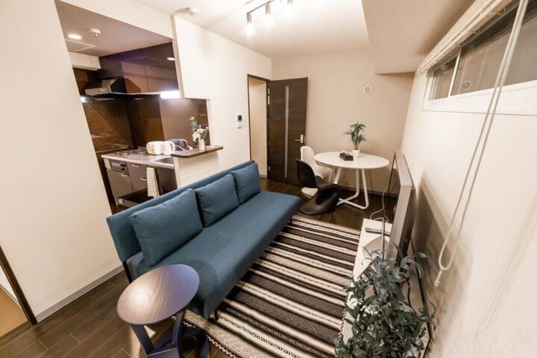 Apartment, Non Smoking | Living area | Flat-screen TV