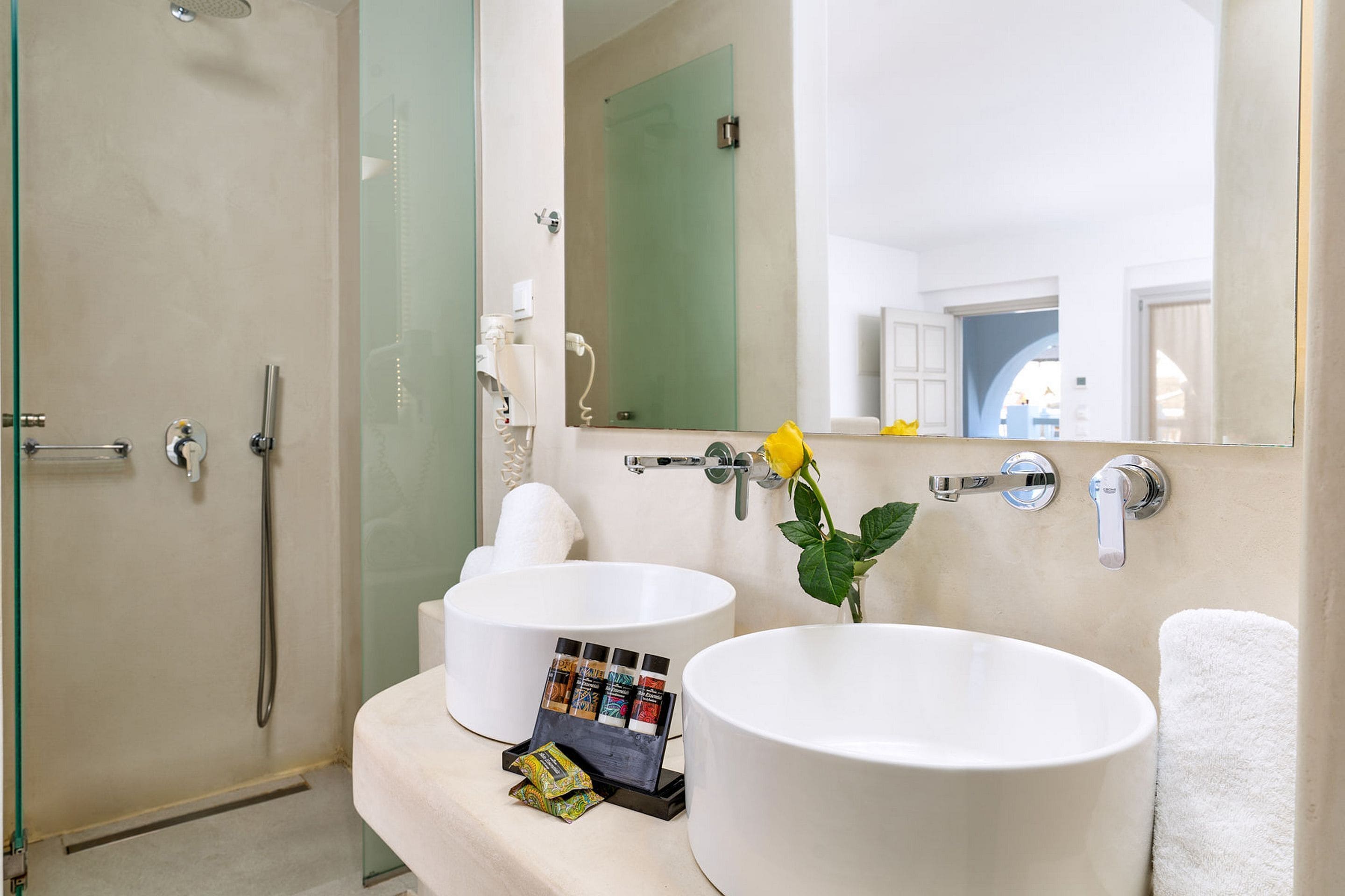 shower, hair dryer, slippers, towels