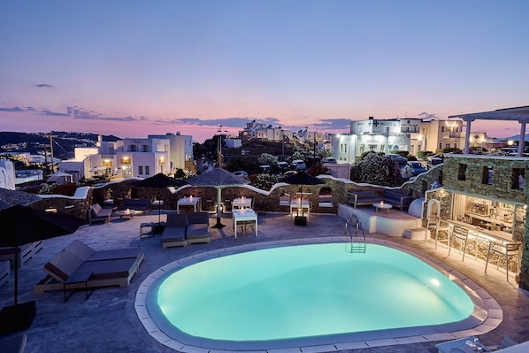 Outdoor pool, open 9:00 AM to 7:00 PM, pool umbrellas, pool loungers