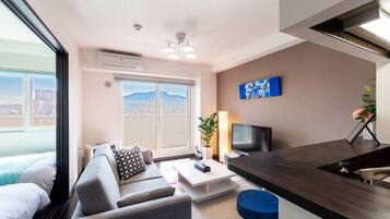 Apartment, Non Smoking | Living area | Flat-screen TV