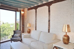 Deluxe Apartment, 2 Bedrooms, Mountain View | Living area | 50-inch Smart TV with satellite channels, TV - La Corrala del Realejo (Granada)