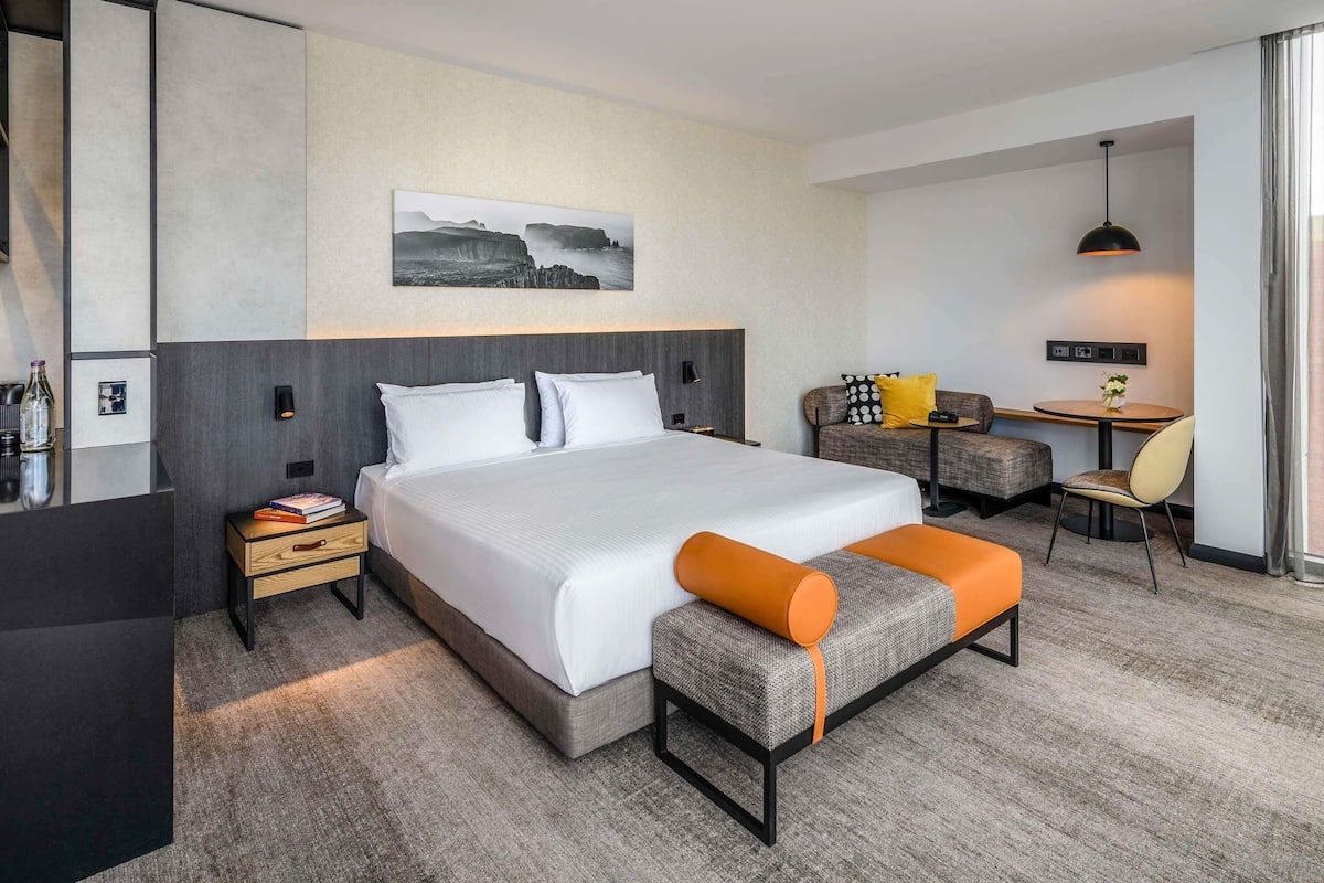 Suite, City View | Premium bedding, minibar, in-room safe, individually decorated
