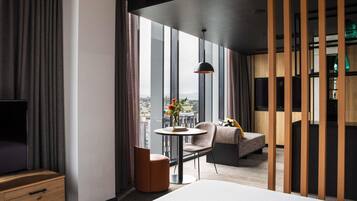 Suite, City View | Premium bedding, minibar, in-room safe, individually decorated