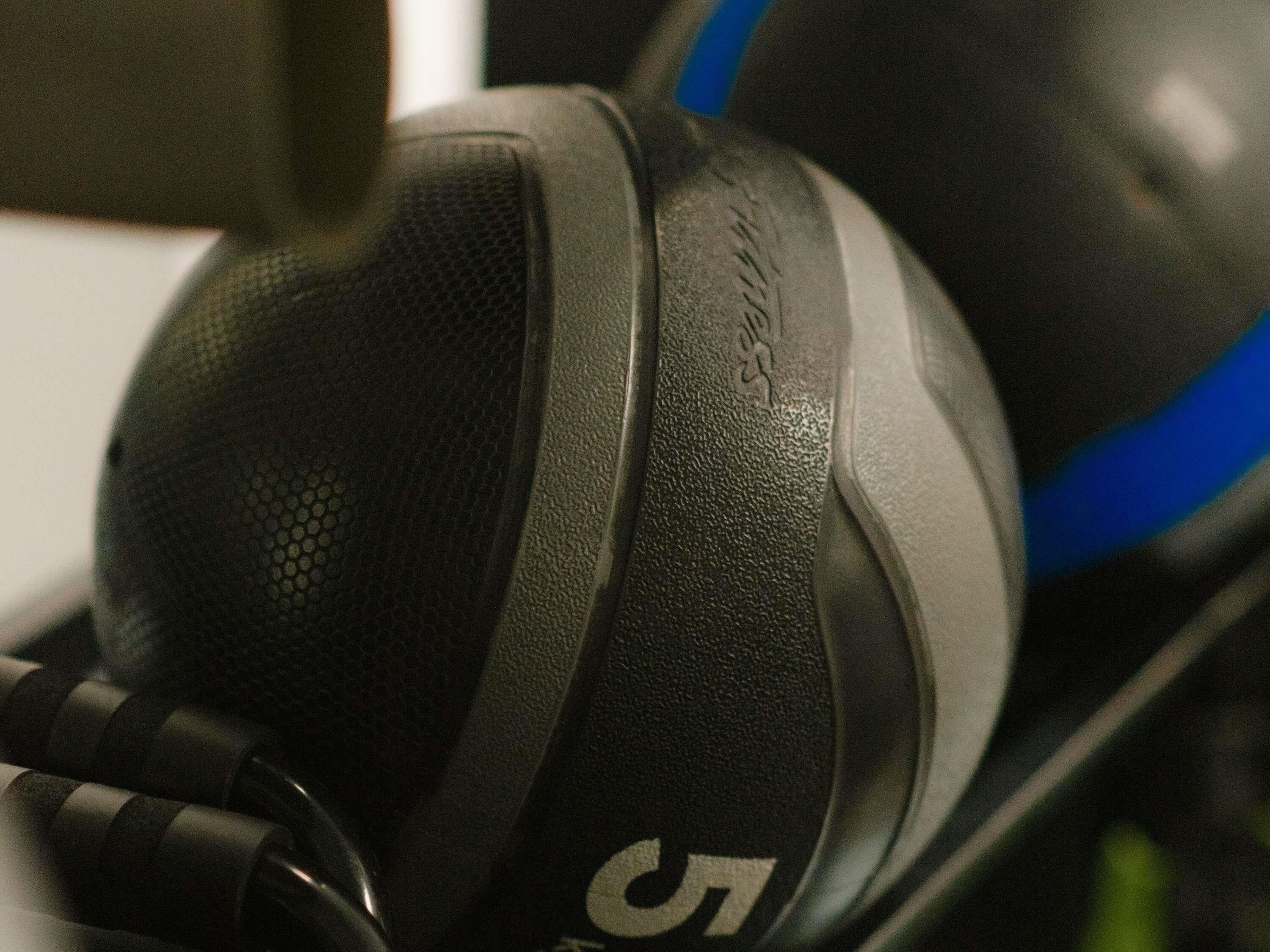 A close-up of a black and blue object with a textured surface and a visible number '5'.