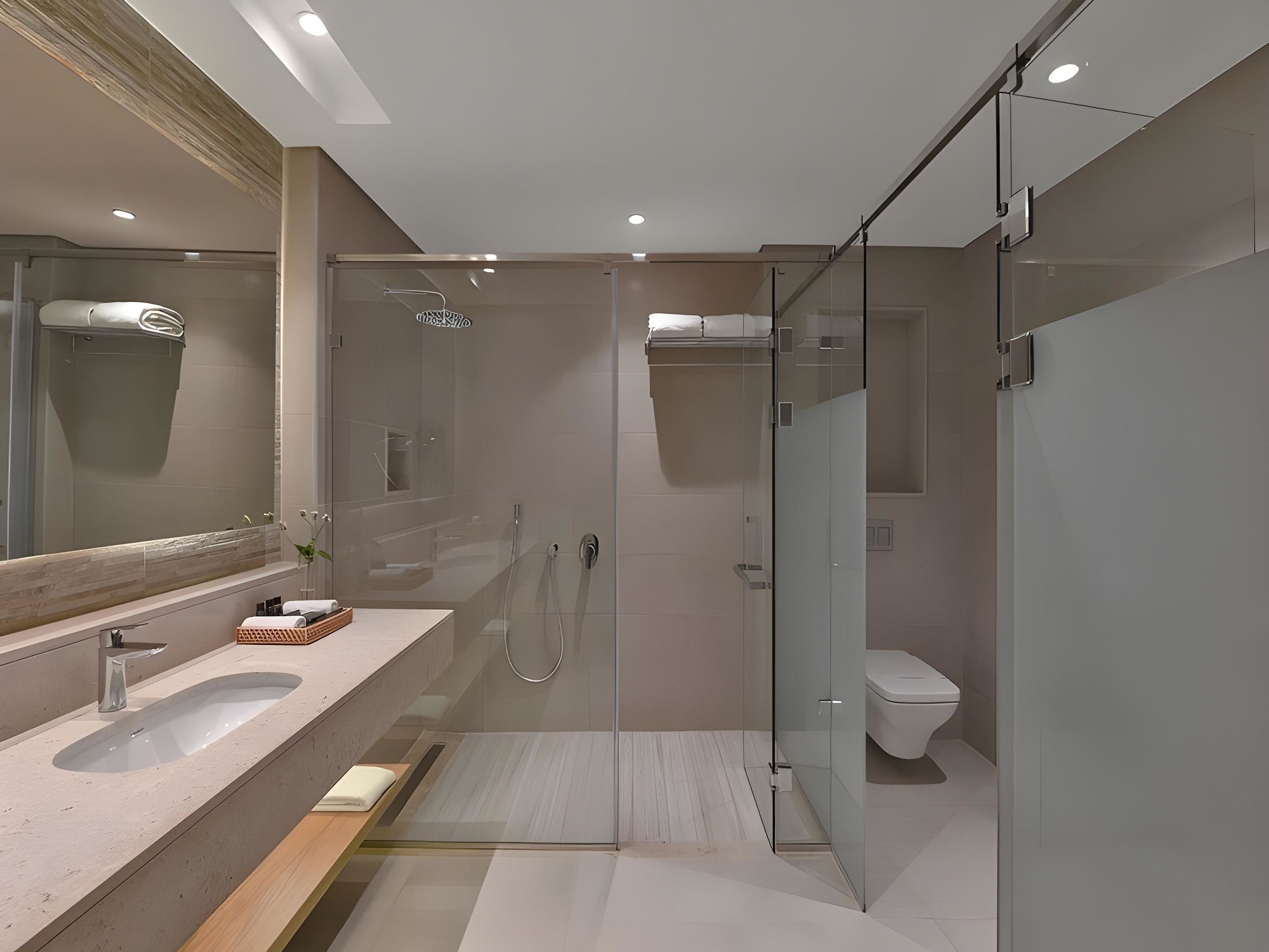 A modern bathroom with a glass shower enclosure, a vanity with a sink, and a toilet.