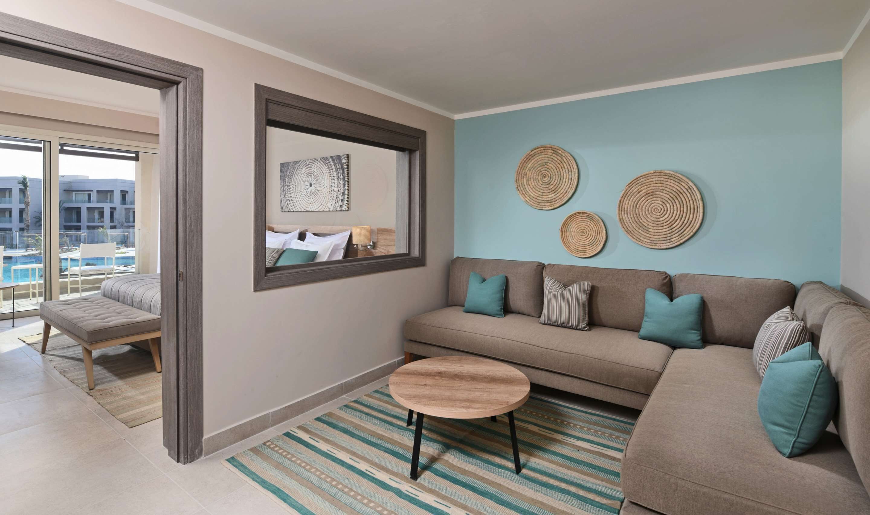 family room, pool view (deluxe, queen or twin) | living area | flat-screen tv