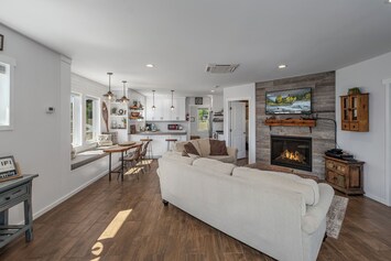 Open concept living with cozy gas fireplace