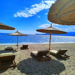 On the beach, sun-loungers, beach umbrellas, beach towels