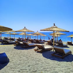 On the beach, sun-loungers, beach umbrellas, beach towels