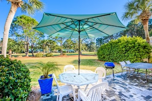 Enjoy al fresco dining and cooking on the patio, surrounded by lush greenery and a tranquil atmosphere.