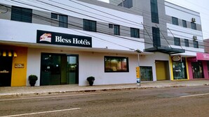 A hotel named 'Bless Hotels' with a modern facade, large windows, and a visible address number '3917'. - Hotel Bless (Cascavel)