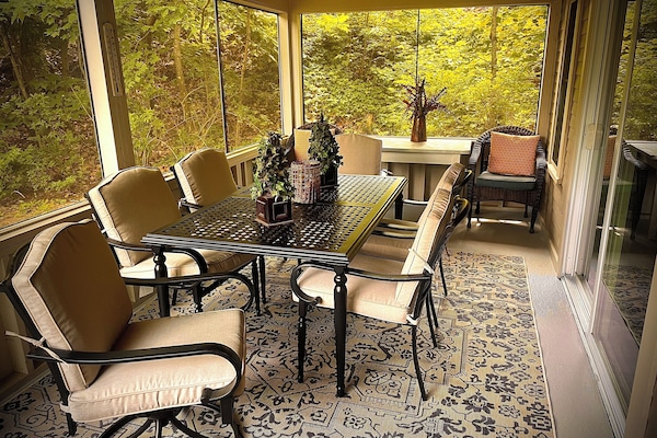 Enjoy screened porch for relaxing or have dinner with new table set