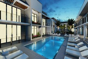Outdoor pool, a heated pool - Modern New Condo Close to Beach (Naples)