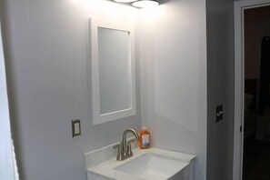 Bathtub, hair dryer, towels, soap
