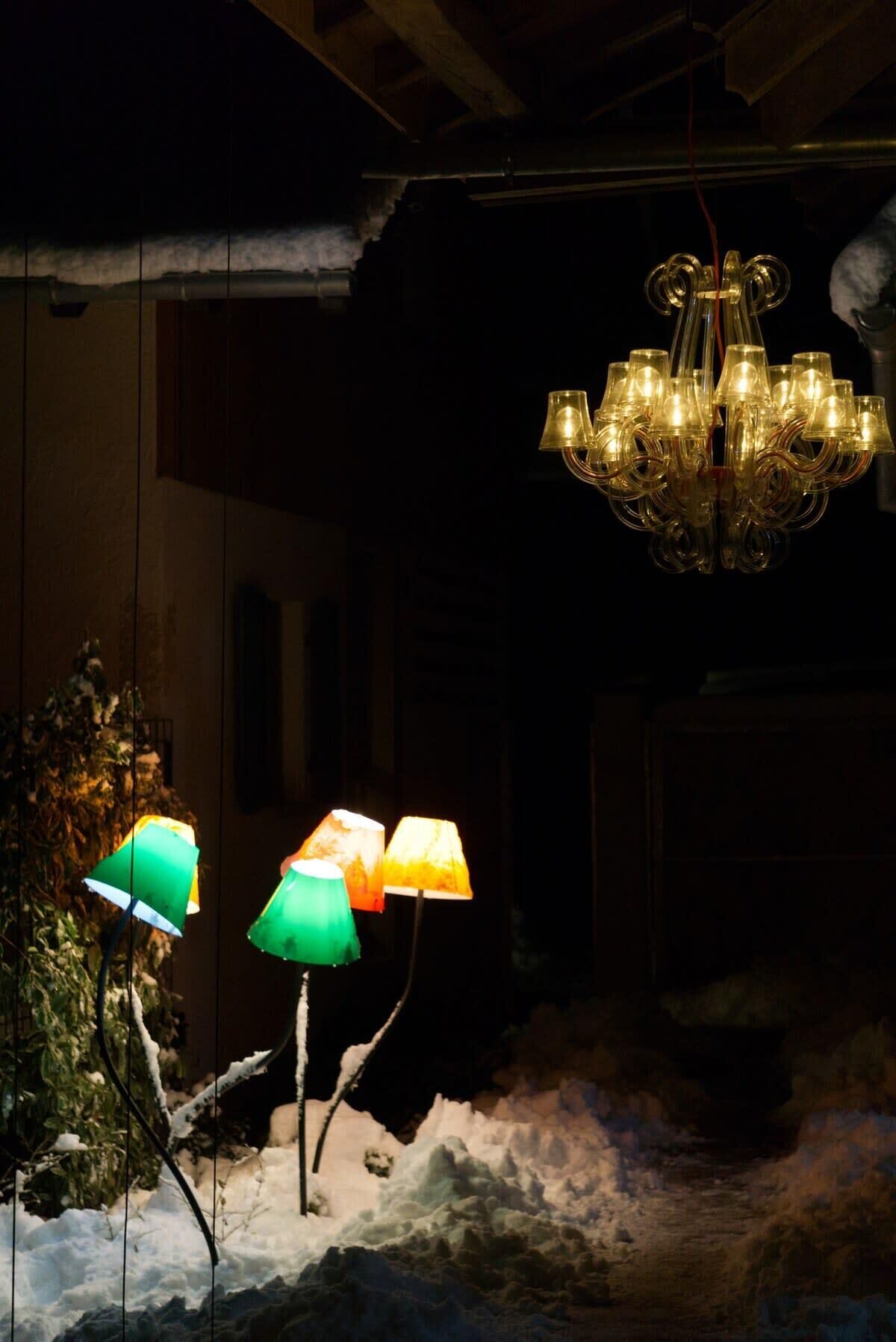 A chandelier with multiple lights hanging from the ceiling.