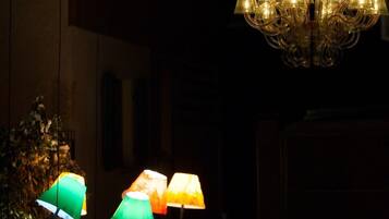 A chandelier with multiple lights hanging from the ceiling.