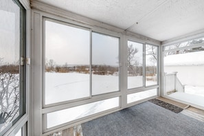 Enjoy a serene view of the snowy landscape from the room's large window.