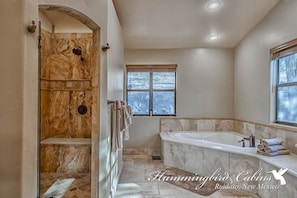 Shower, jetted tub, towels
