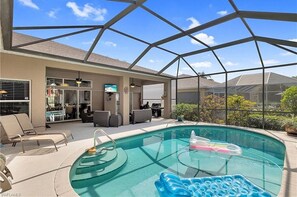 Outdoor pool, a heated pool - Spacious private pool home, close to beaches, with many upgrades! (Fort Myers)