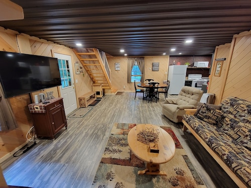 COZY CABIN NEAR A CREEK IN THE FOREST