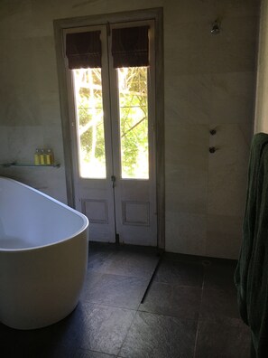 Bathtub, hair dryer, towels, soap