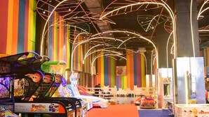 An indoor arcade with various gaming machines and colorful decorations. - The Fern Residency Jamnagar, Series by Marriott (Jamnagar)