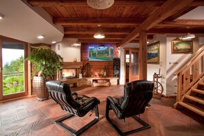 Family Chalet, 3 Bedrooms, Mountainside (Chalet Podgorje With Pool) | Living area | 21-inch flat-screen TV with digital channels, TV, fireplace