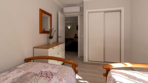 Un dormitorio con dos camas de madera, un aparador, un espejo y un armario.