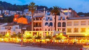 A coastal hotel with a beach view, multiple dining areas, and a prominent dome structure. - Leo Street 96, Tossa de Mar-Lesal Villas Rentals Mar Azul (Santa maria de llorell, tossa de mar, gi)