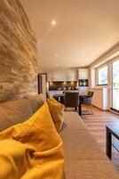Premium Condo | Living area | 100-cm Smart TV with cable channels, TV, heated floors