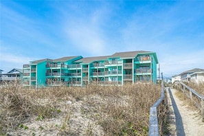 Situated on a sandy beach, this building offers stunning views from its balconies.